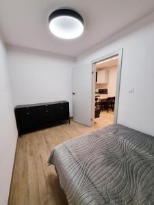 Postel nebo postele na pokoji v ubytování SunMarine Hel