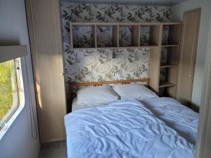 Postel nebo postele na pokoji v ubytování Camping De Blauwe Reiger