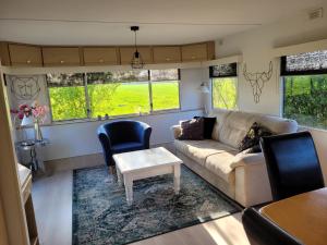 Posezení v ubytování Camping De Blauwe Reiger