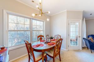 a dining room with a table and chairs and a window at Creekwood --- 100 Cascade Ln, #109 in Rehoboth Beach