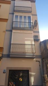 a building with two balconies and a window at Luxury Estudio Malaga Centro in Málaga