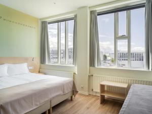 Postel nebo postele na pokoji v ubytování Reykjavik Lights Hotel by Keahotels + 37 fotografií