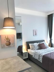 Posteľ alebo postele v izbe v ubytovaní Exclusive Apartments Smolna