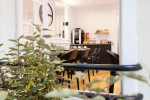 a dining room with a table and some chairs at Nord Est Hotel in Paris