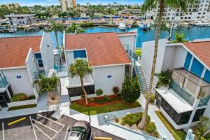 an aerial view of a house with a marina at 261 G Madeira Beach Yacht Club in St. Pete Beach