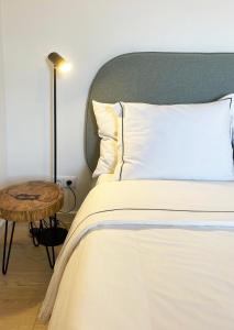 En eller flere senge i et værelse på Casa Sagres T2 - 3 minutos a pé Praia da Mareta
