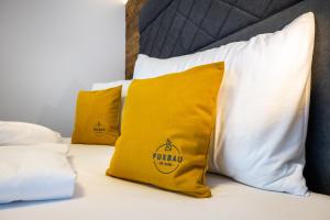 Łóżko lub łóżka w pokoju w obiekcie Aparthotel Fuxbau