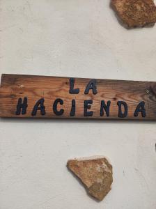a sign on a wall with the words la ahanland at La Hacienda de Tefia in Tefía