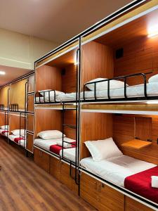 a group of bunk beds in a room at Rahul Men's AC Dormitory in Navi Mumbai