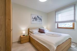 Ένα ή περισσότερα κρεβάτια σε δωμάτιο στο Apartament Grajcarek +14 φωτογραφίες