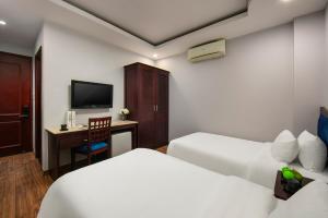 Cama ou camas em um quarto em Cristina Center Hotel & Spa