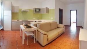 a living room with a couch and a table at Apartamento Garro by SanSe Holidays in San Sebastián