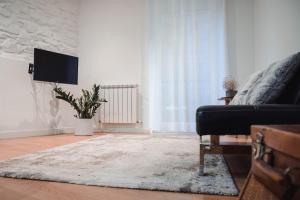 Televízia a/alebo spoločenská miestnosť v ubytovaní Apartamento Zurriola by SanSe Holidays