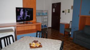 TV a/nebo společenská místnost v ubytování La casa di Dario