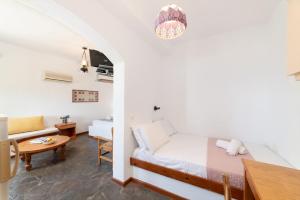 Postel nebo postele na pokoji v ubytování Kounenos Apartments