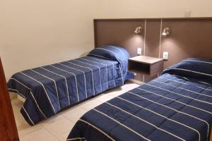 Una cama o camas en una habitación de Linda Casa p/5 personas en Salta Capital