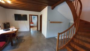 A television and/or entertainment centre at Easy Home Johanna - Central Kirchberg