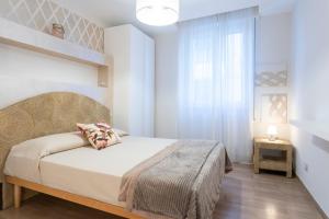 Ένα ή περισσότερα κρεβάτια σε δωμάτιο στο Residenza Felix by Mmega
