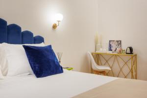 Postel nebo postele na pokoji v ubytování SM Mellini Relais B&B
