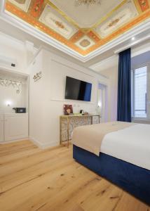 Postel nebo postele na pokoji v ubytování SM Mellini Relais B&B