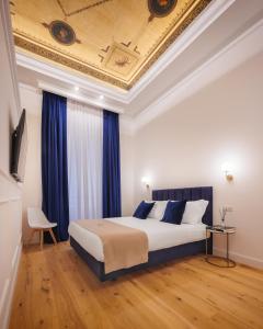 Postel nebo postele na pokoji v ubytování SM Mellini Relais B&B