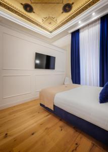 Postel nebo postele na pokoji v ubytování SM Mellini Relais B&B