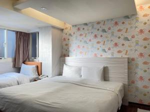 Katil atau katil-katil dalam bilik di Jung Shin Hotel