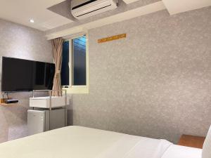 Televisyen dan/atau pusat hiburan di Jung Shin Hotel