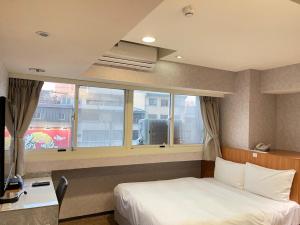 Katil atau katil-katil dalam bilik di Jung Shin Hotel