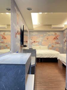 Katil atau katil-katil dalam bilik di Jung Shin Hotel