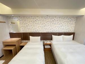 Katil atau katil-katil dalam bilik di Jung Shin Hotel