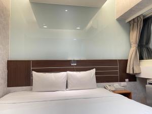 Katil atau katil-katil dalam bilik di Jung Shin Hotel