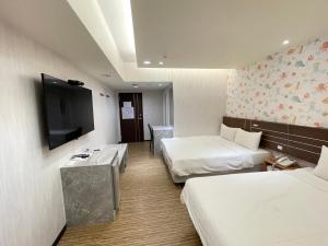 Katil atau katil-katil dalam bilik di Jung Shin Hotel