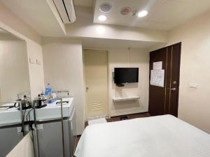 Televisyen dan/atau pusat hiburan di Jung Shin Hotel
