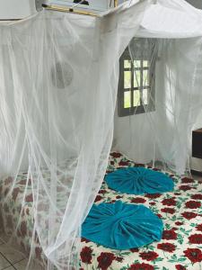 Uma cama ou camas num quarto em MangoBrazil
