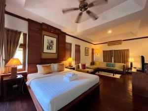 Ein Bett oder Betten in einem Zimmer der Unterkunft Green Papaya Beach Resort, Koh Phangan