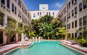 a swimming pool in the middle of a building at Tropicals of Palm Beach in Palm Beach