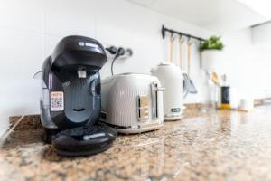 a appliance sitting on a counter in a kitchen at Leonor&Pablo in Oviedo