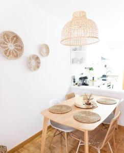 a kitchen with a table and chairs in a room at Leonor&Pablo in Oviedo