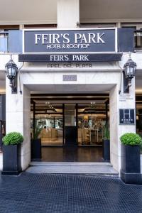 a entrance to a building with a sign for a store at Feir's Park Hotel & Rooftop in Buenos Aires