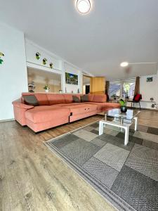 a living room with a couch and a table at Ferienwohnung Apolo in Münstermaifeld