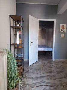 a hallway with a door leading to a bedroom at "Orpheus" - Kalamata Centre in Kalamata