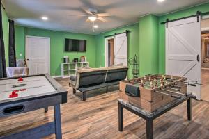 a living room with a ping pong table and a game room at Pet-Friendly Finger Lakes Home Near Ithaca! 