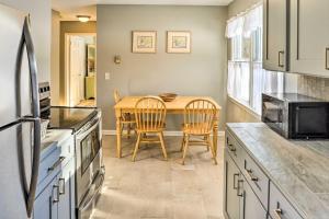 a kitchen with a table and chairs in a kitchen at Cozy Southern Vermont Home with On-Site Trails in Whitingham