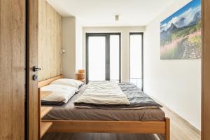 Posteľ alebo postele v izbe v ubytovaní ZAKOHOME- Apartamenty Sabały
