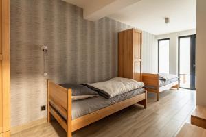 Posteľ alebo postele v izbe v ubytovaní ZAKOHOME- Apartamenty Sabały