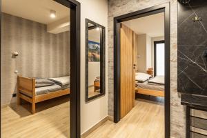 Posteľ alebo postele v izbe v ubytovaní ZAKOHOME- Apartamenty Sabały