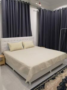 Säng eller sängar i ett rum på Inap Singgah Homestay
