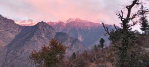 a view of a mountain range with snow capped mountains at Shrikanth Homestay in Joshīmath