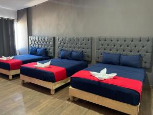 Postel nebo postele na pokoji v ubytování Hotel La Intimidad